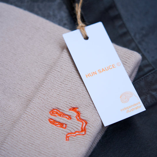 SMILEY Embroidery Beanie Hat, Smile Rave Festival Cosy Hat, by Hun Sauce. Cream beanie hat with bright orange stitching smiley design.