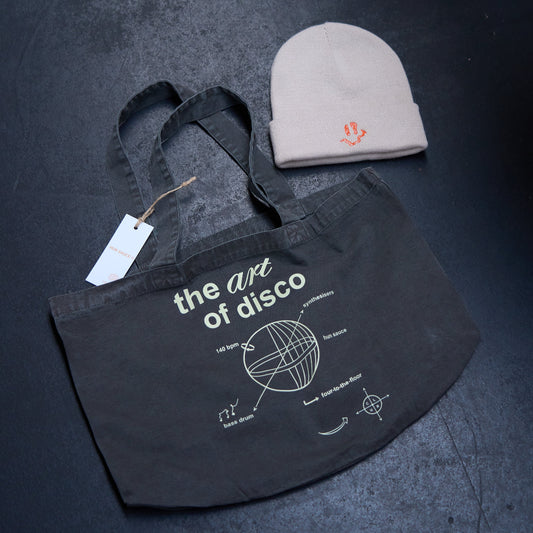 SMILEY Embroidery Beanie Hat, Smile Rave Festival Cosy Hat, by Hun Sauce. Cream beanie hat with bright orange stitching smiley design. With Art of Disco Tote Bag.