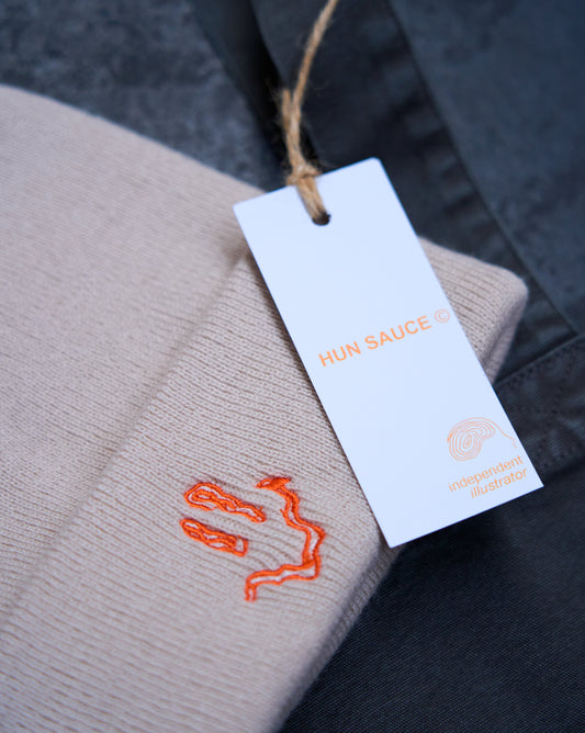 SMILEY Embroidery Beanie Hat, Smile Rave Festival Cosy Hat, by Hun Sauce. Cream beanie hat with bright orange stitching smiley design. 