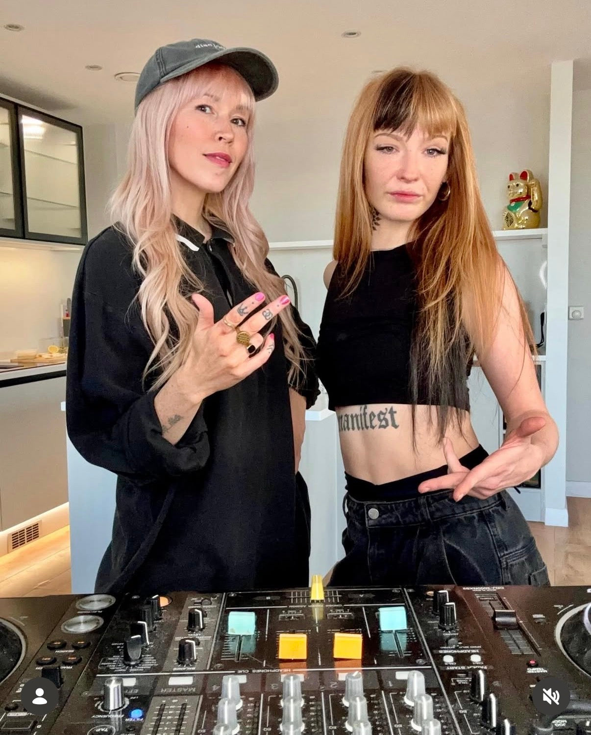 DJ Shosh in the DJ Cap from Hun Sauce. Uk Streetwear fror the music crowd. With rapper Maddy V