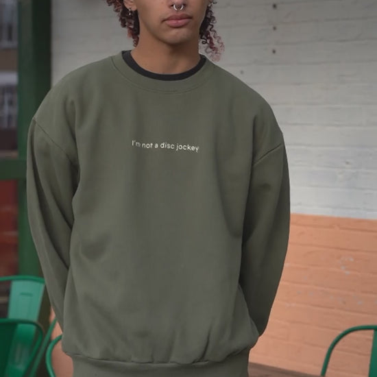 video of  I'M NOT A DJ Heavyweight Sweater, Rave Streetwear, Graphic DJ Sweat, By Hun Sauce. Independent streetwear brand. Now stocked at All My Friends, store, Hackney Wick.