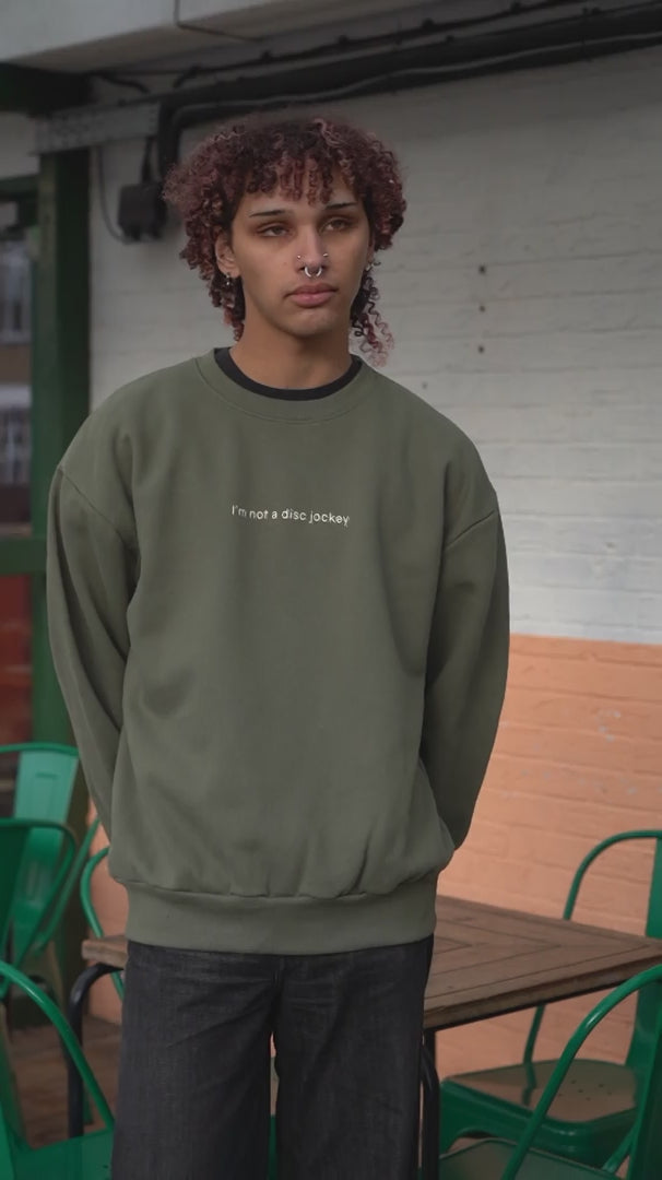 video of  I'M NOT A DJ Heavyweight Sweater, Rave Streetwear, Graphic DJ Sweat, By Hun Sauce. Independent streetwear brand. Now stocked at All My Friends, store, Hackney Wick.
